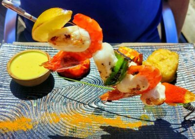 Grilled shrimp skewer with dipping sauce at Table d'hôtes bayeux, la ferme manoir saint barthélemy.