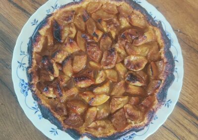 Table d'hôtes bayeux: Delicious homemade apple tart on a blue and white patterned plate.