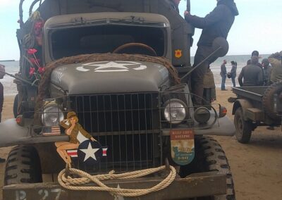 Vintage military truck at a D-Day commemoration in Normandy.