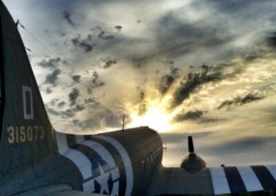 C-47 Skytrain at sunset, Normandy. Relevant to L'Histoire du Débarquement et de la Bataille de Normandie.