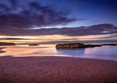 Arromanches beach at dusk, remnants of the D-Day landing. Normandie coast.